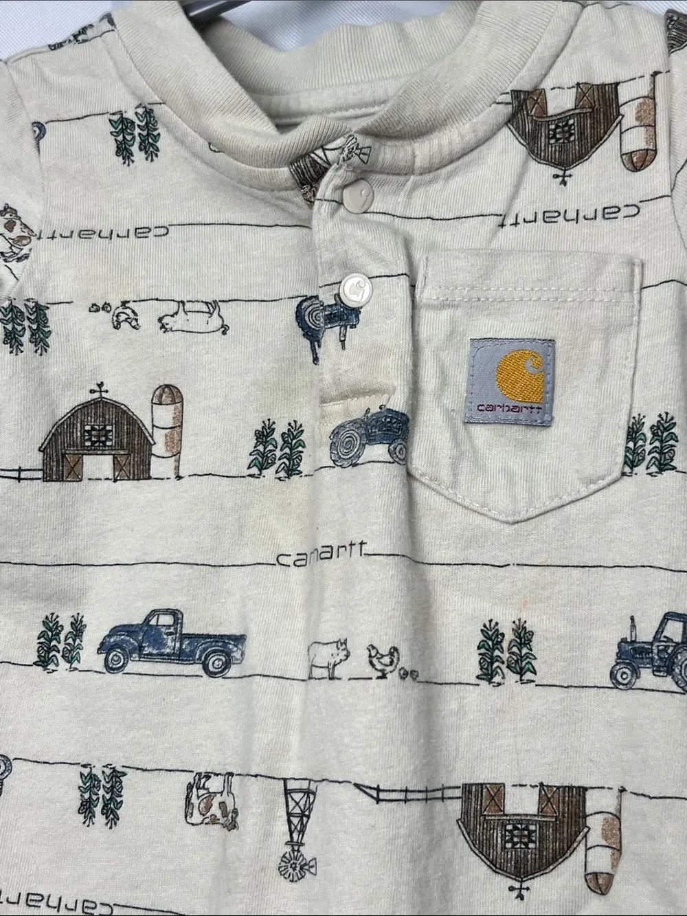 Carhartt tan farm print one piece Henley pocket tee. Size 6 months